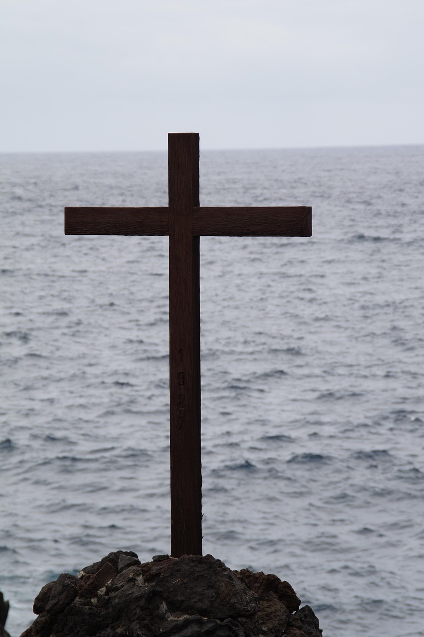 Cross by ocean