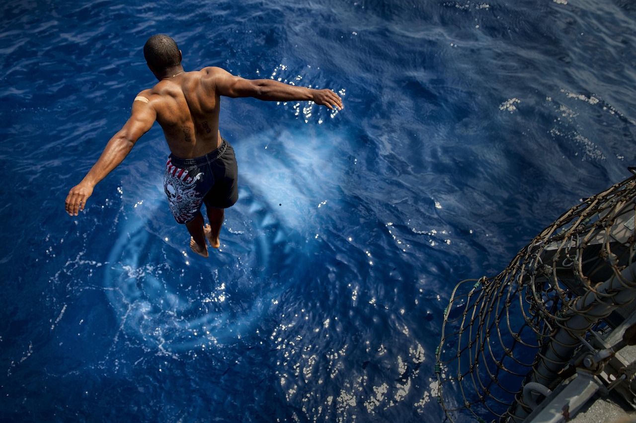 Man jumping towards shark