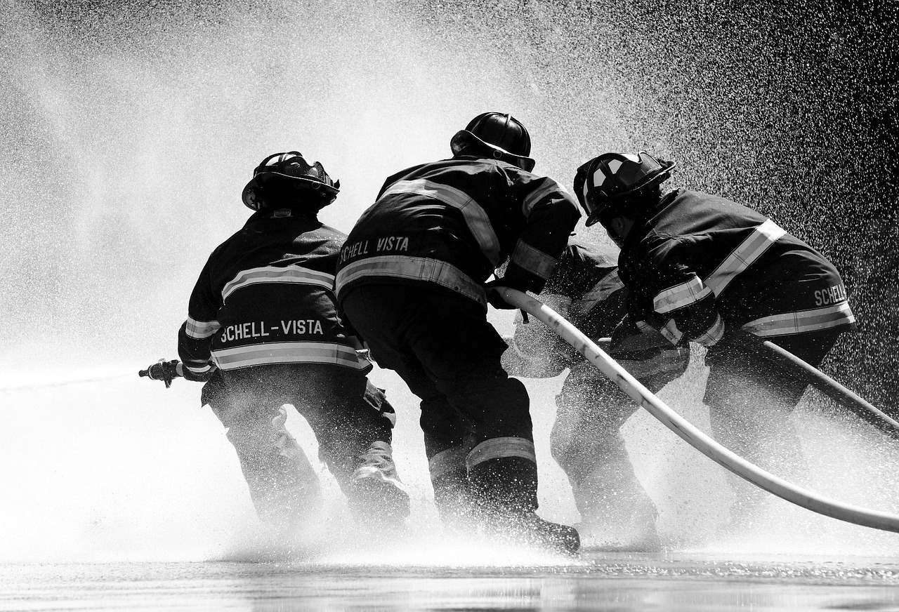 Firefighters with water spray
