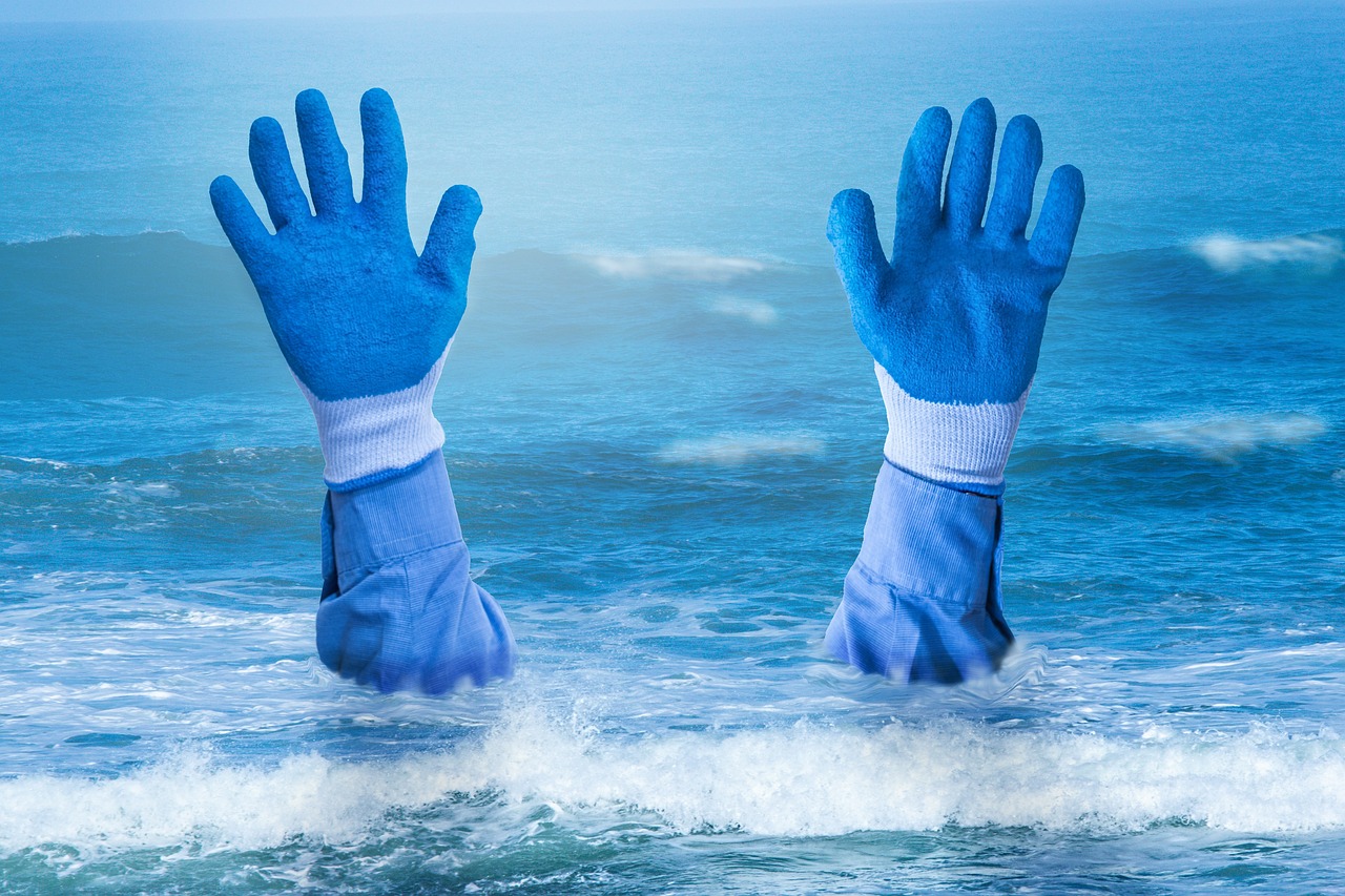 Hands with blue gloves